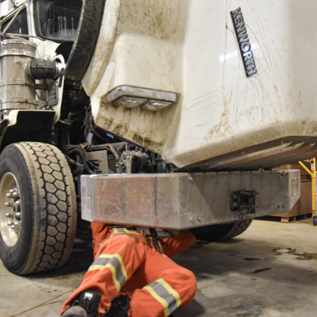 A Revolution Crane Technician servicing vehicle