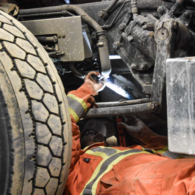 Revolution Crane Technician performing a repair