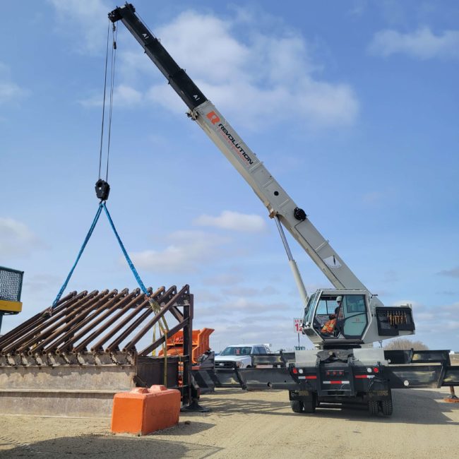 A Revolution Crane Operator lifting a structure